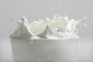 Glass of milk splashing