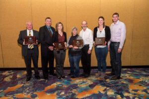FARM Excellence Award Winners Holding Awards