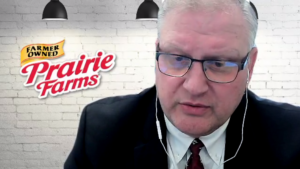 Prairie farms logo next to man in virtual meeting