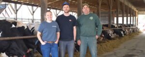 Smiling dairy farmers