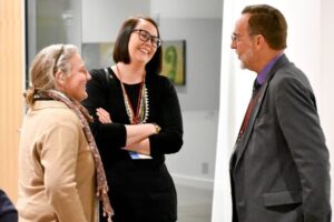 Group of three people smiling and talking, Dairy Groups Endorse Alexis Taylor Nomination as USDA’s Top Trade Official