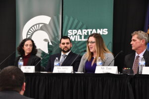 Panel speaks at table