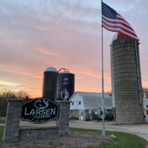 Larsen farm sign at sunset
